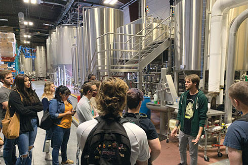 Students learning about brewing at Calusa Brewery