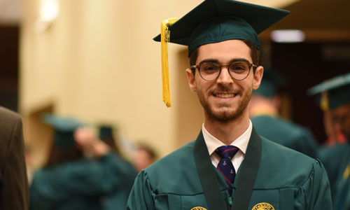 Student in cap and gown.