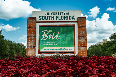 A sign on the Tampa campus says, "Be Bold!"