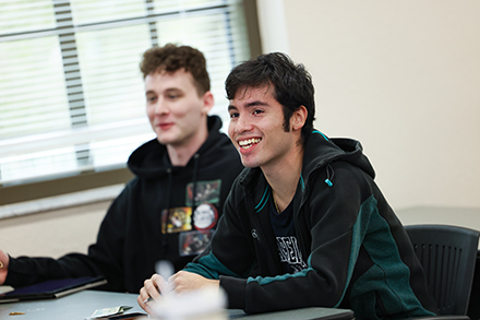 Two USF Sarasota-Manatee students participate in class discussion